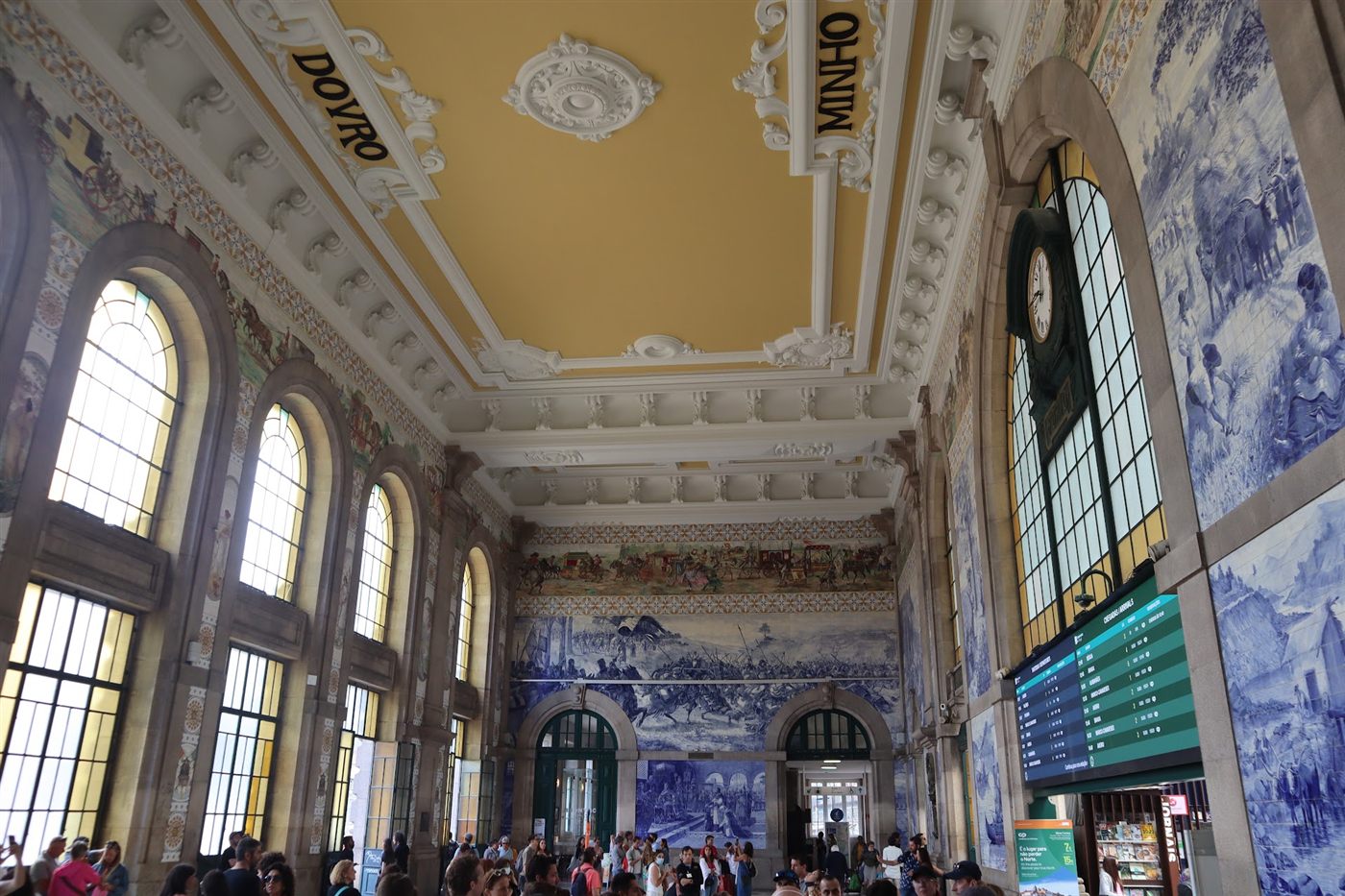 Blue azulejo tile murals and a gilded ceiling in Porto's São Bento station